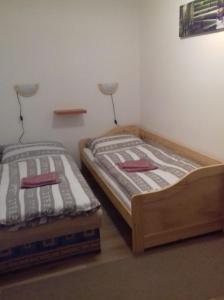 Postel nebo postele na pokoji v ubytování apartmán U parku