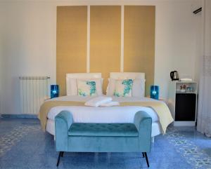 En eller flere senge i et værelse på Piazza Tasso B&B Relais