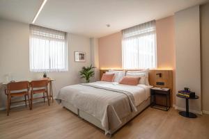 Postel nebo postele na pokoji v ubytování Artist Hotel - an Atlas Boutique Hotel