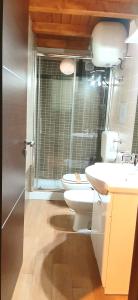 a bathroom with a toilet and a sink at Castello Apartment Deluxe in Sciacca