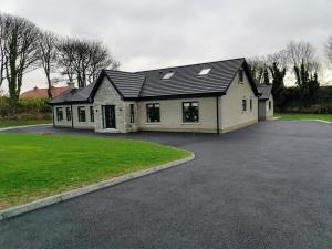 a house with a driveway in front of it at Slievescape in Newry