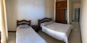 Postel nebo postele na pokoji v ubytování Hotel Lazer Piata