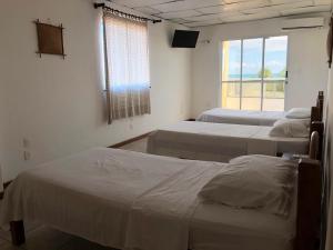 Postel nebo postele na pokoji v ubytování Hotel Lazer Piata