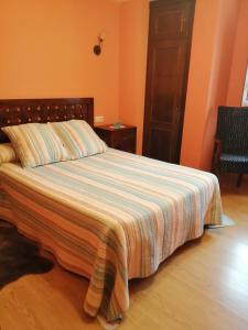 Postel nebo postele na pokoji v ubytování APARTAMENTOS RURALES EL PRIVILEGIO
