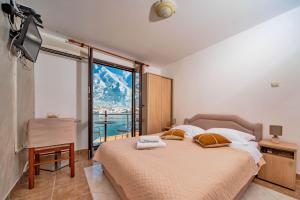 Postel nebo postele na pokoji v ubytování Apartments Marković + 37 fotografií