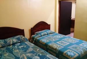 Postel nebo postele na pokoji v ubytování Hotel Quinta San Juan