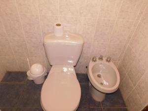 a bathroom with a toilet and a sink at Las Dulcineas in La Paloma +28 photos