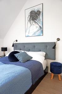 En eller flere senge i et værelse på Art Apartment