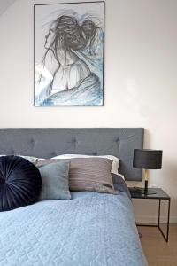 Cama o camas de una habitación en Art Apartment