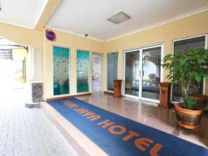 a large room with a blue welcome mat on the floor at Puri Jaya Hotel in Jakarta