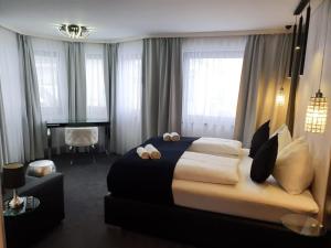 Łóżko lub łóżka w pokoju w obiekcie The Place Boutique & Design Hotel Flachau