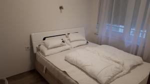 Postel nebo postele na pokoji v ubytování Lido riviera apartman
