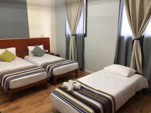 Postel nebo postele na pokoji v ubytování Villa Nazareth B&B + 21 fotografií