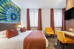 Postel nebo postele na pokoji v ubytování Best Western Plus Monopole Métropole
