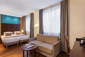 Postel nebo postele na pokoji v ubytování Best Western Plus Monopole Métropole
