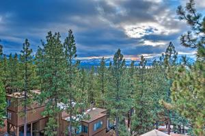 a building in the middle of a forest of trees at 2 Mi to Heavenly Mountain Tahoe Retreat with Views in Stateline