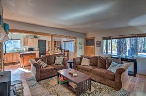 a living room with two couches and a table at Cozy Mountain Cabin about 7 Mi to Heavenly Ski Resort! in South Lake Tahoe
