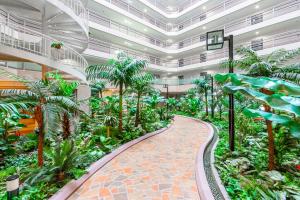 arium of a building with palm trees and a walkway at BIOSvilla522-Sapporo Susukino Night- 1Room W-beds2&S-beds2 6Persons in Sapporo