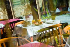 a table with a plate of food on it at Haras Aritza in Ojedo
