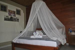 Ein Bett oder Betten in einem Zimmer der Unterkunft Rumah Roda