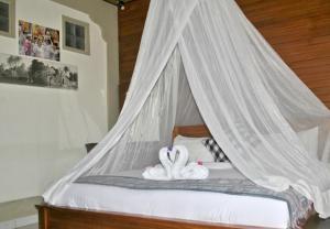 Ein Bett oder Betten in einem Zimmer der Unterkunft Rumah Roda