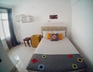 Postel nebo postele na pokoji v ubytování Miss Hotel Karya