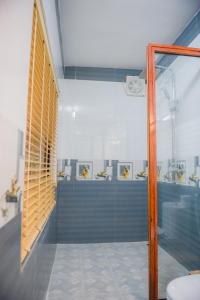 a bathroom with a shower with a glass door at Tam Coc Three Princess Homestay in Ninh Binh