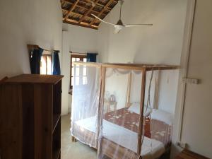 Postel nebo postele na pokoji v ubytování Surfpoint Sri Lanka Kite Village
