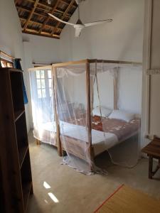 Postel nebo postele na pokoji v ubytování Surfpoint Sri Lanka Kite Village