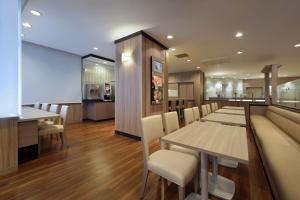 a dining room with a long table and chairs at Keio Presso Inn Tokyo Kudanshita in Tokyo