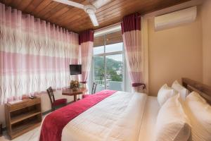 Postel nebo postele na pokoji v ubytování Sobaya Hotel