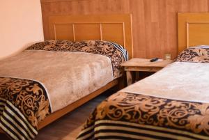 Giường trong phòng chung tại Hostal Quinto Sol Huamantla +200 ảnh