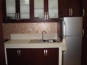 Kuchyň nebo kuchyňský kout v ubytování The Oasis Davao Condotel