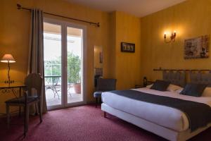 Un ou plusieurs lits dans un hébergement de l'établissement The Originals City, Hôtel Le Village Provençal, Aix-en-Provence Nord (Inter-Hotel)