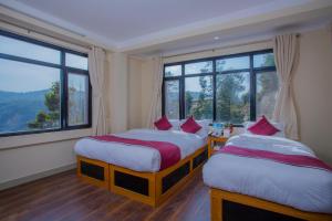 Postel nebo postele na pokoji v ubytování Asha Lodges + 33 fotografií