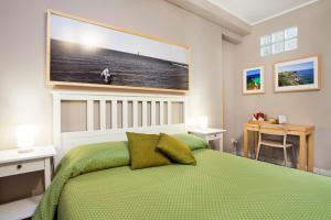 A bed or beds in a room at TerraSole Bakery B&B