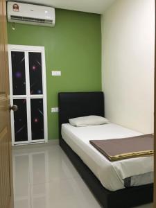 Postel nebo postele na pokoji v ubytování Hotel 3Winz, Chow Kit Hospital Kuala Lumpur