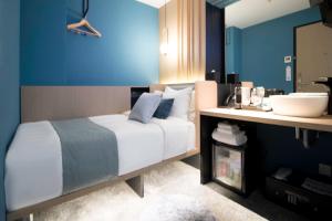 Postel nebo postele na pokoji v ubytování Hotel NuVe Elements
