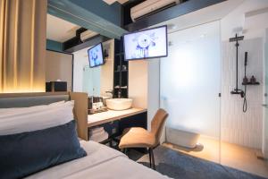TV a/nebo společenská místnost v ubytování Hotel NuVe Elements