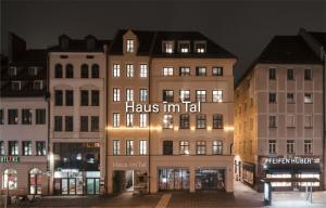 a building with a sign that says has imigil on it at Haus im Tal in Munich