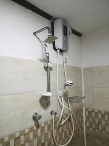 a shower in a bathroom with a shower at Lasindu Guest in Ahangama +34 photos