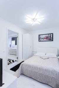 Postel nebo postele na pokoji v ubytování Apartments Roomer