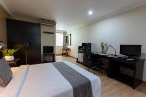 Ένα ή περισσότερα κρεβάτια σε δωμάτιο στο Technopark Hotel