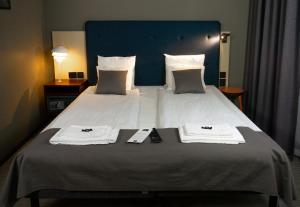 Säng eller sängar i ett rum på First Hotel Central