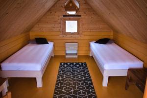 Кровать или кровати в номере Fossatun Camping Pods & Cottages - Sleeping Bag Accommodation
