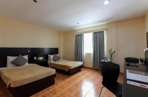 Ένα ή περισσότερα κρεβάτια σε δωμάτιο στο Technopark Hotel