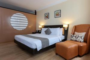 Ένα ή περισσότερα κρεβάτια σε δωμάτιο στο Technopark Hotel