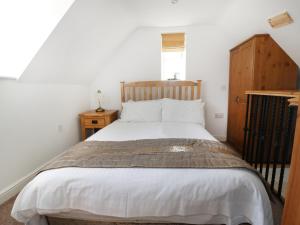 Strine View Cottage tesisinde bir odada yatak veya yataklar