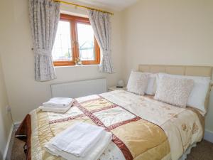 Ένα ή περισσότερα κρεβάτια σε δωμάτιο στο Bramble Grange