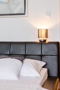 Posteľ alebo postele v izbe v ubytovaní Apartments Flor de Lis